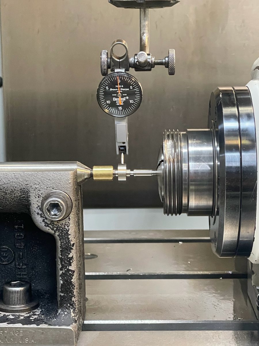 Dial indicator setup checking a small part in a fixture